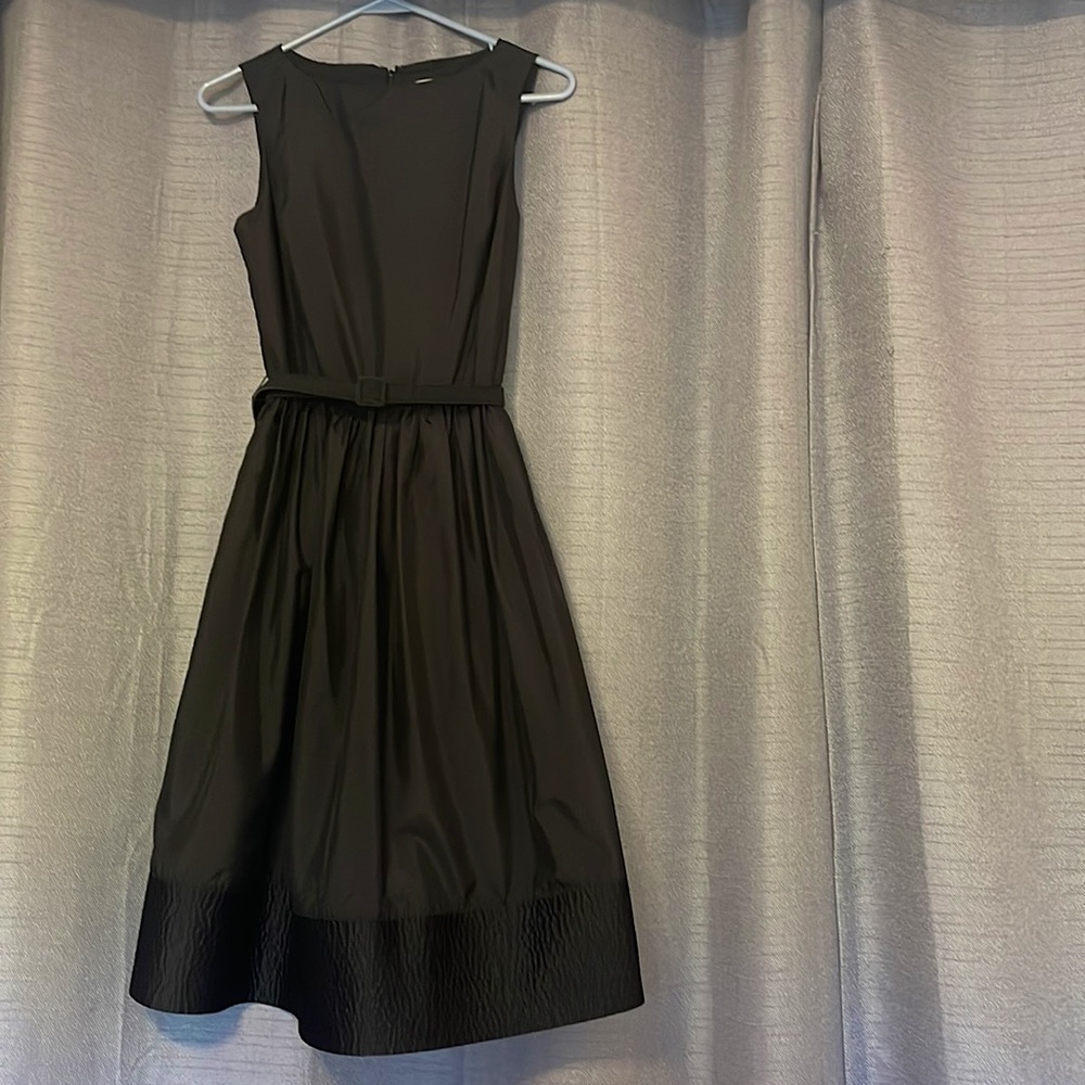 Black Isaac Mizrahi 1950's shin length dress. More formal than casual.